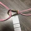 Púder rózsaszín műbőr két szálas aranyozott csatos öv